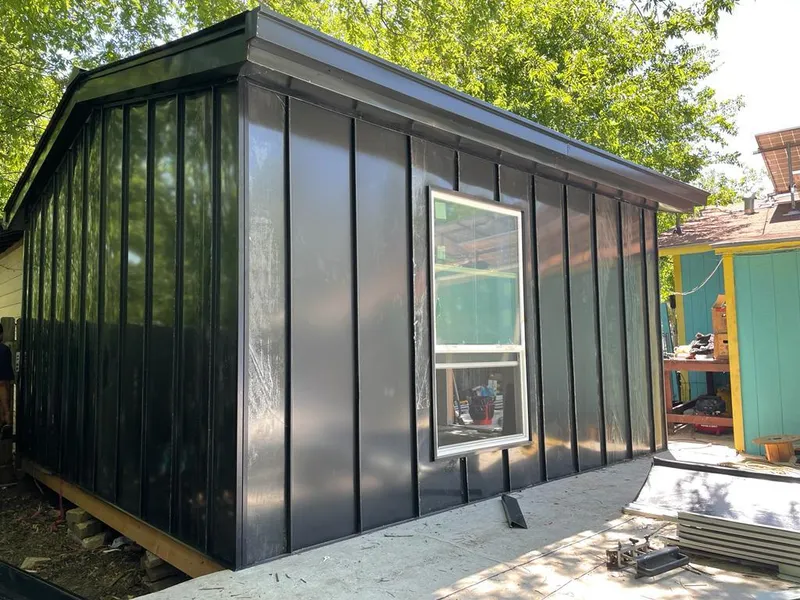 Black standing seam metal wall panels for Roof Inspection in Chenango